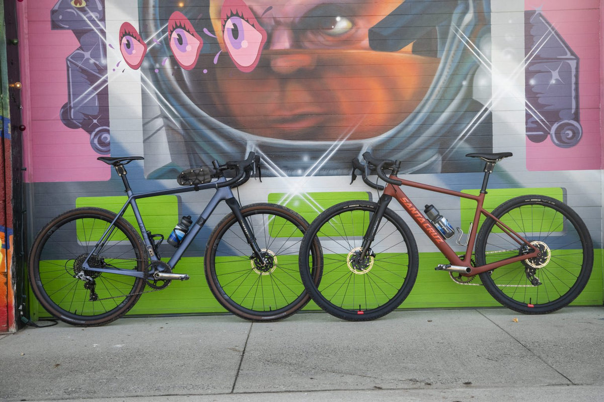 2 Bikes In Front Of Mural