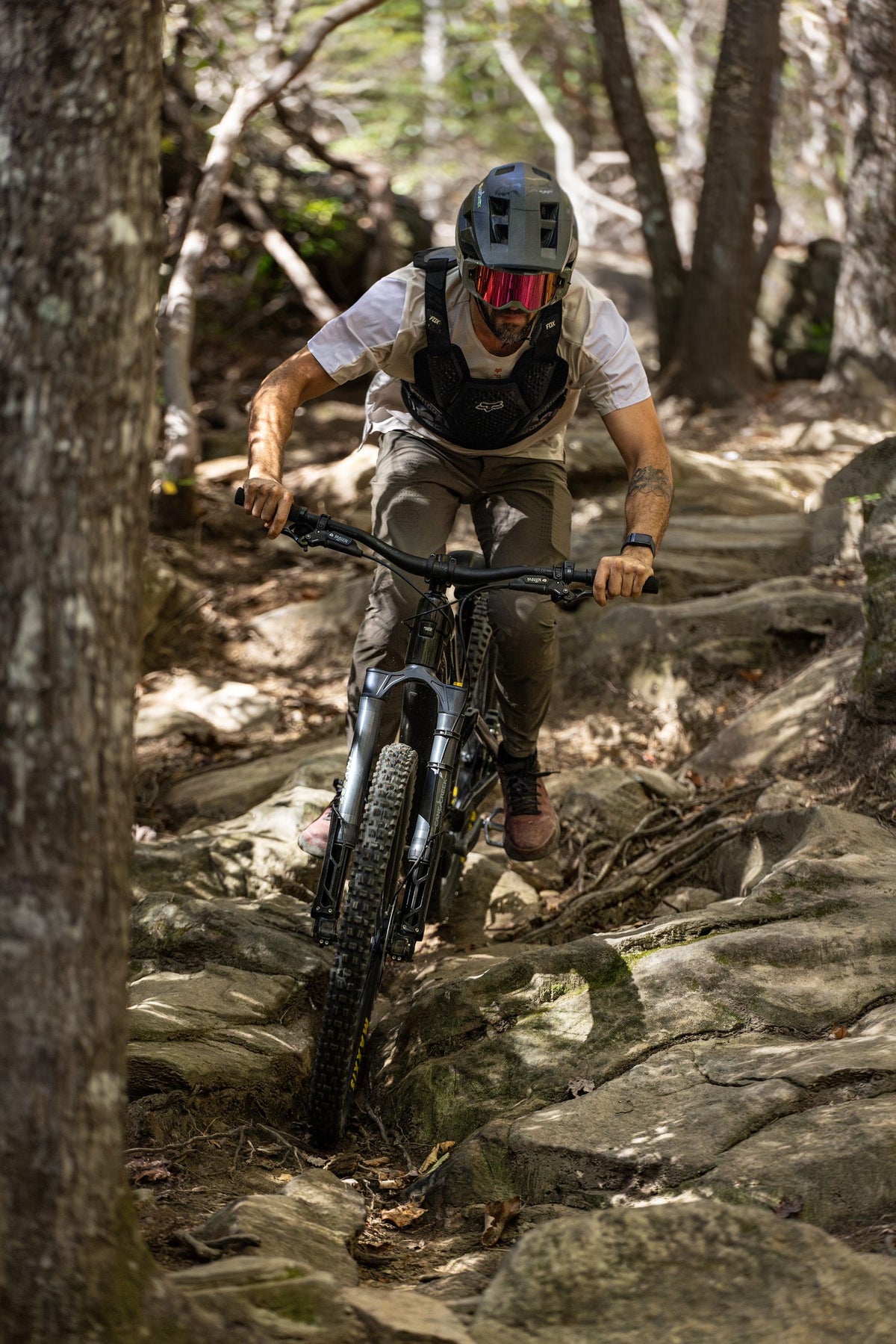 Rider picking through a rock garden on the Invert Enduro fork