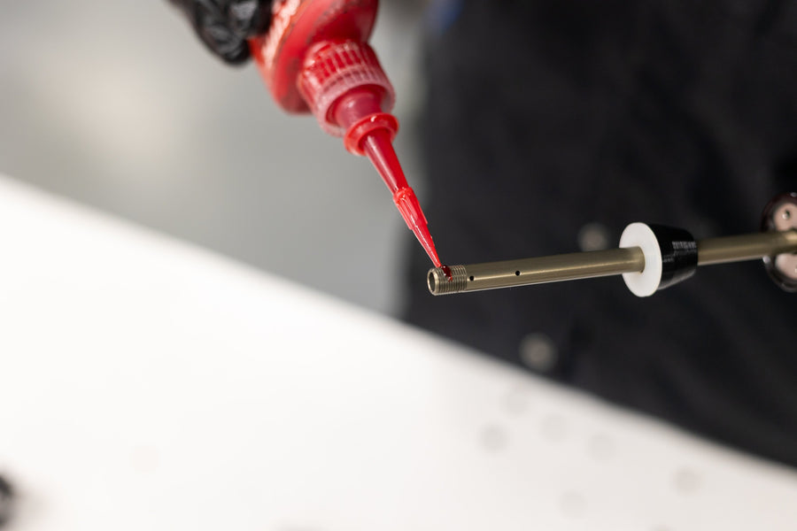 Applying red Loctite to shaft threads