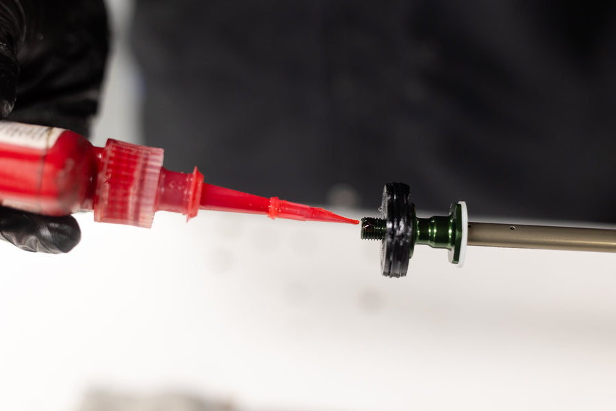 Applying red Loctite before installing air piston nut