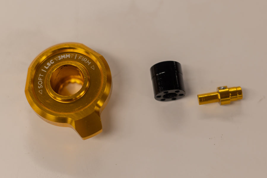 Adjuster cap, HSC and LSC adjusters removed
